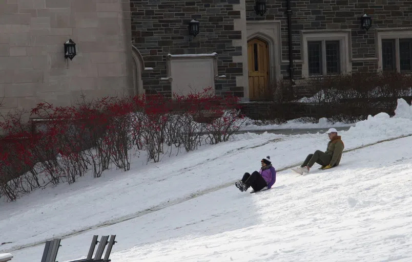 Students sledding Whitman Hill