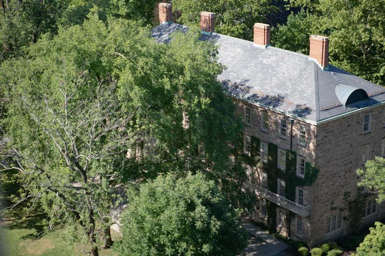 Aerial view of Morrison Hall with trees in front.