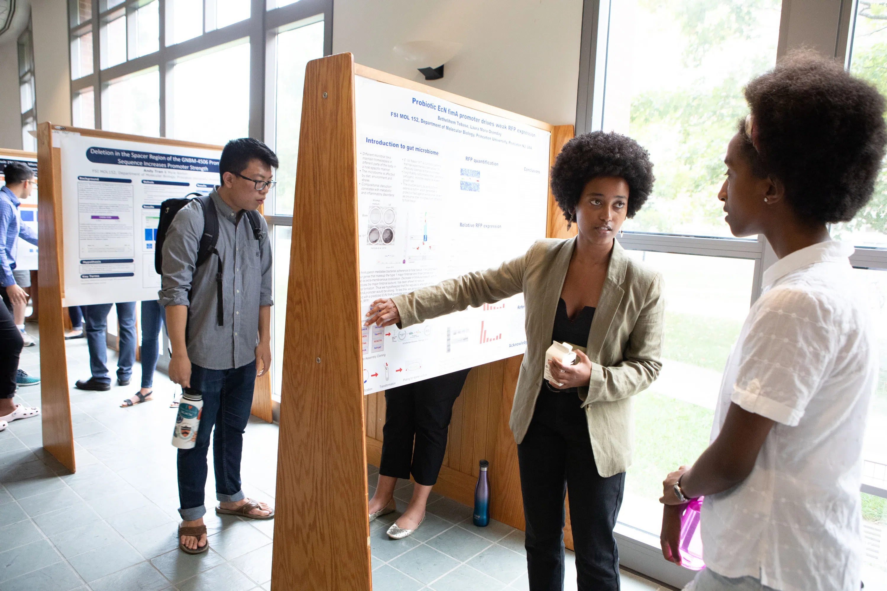 FSI students presenting their Molecular Biology research at a poster session