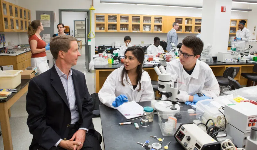 FSI Students talking in a lab 