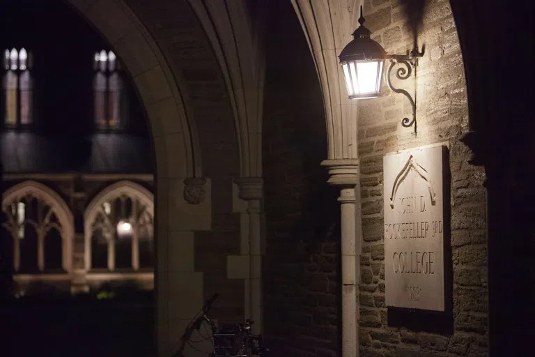 Rocky plaque illuminated by lamp at night