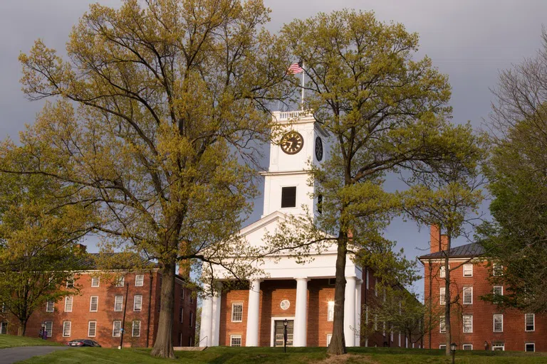 Exterior shot of Johnson Chapel. New England brick building with steeple. 