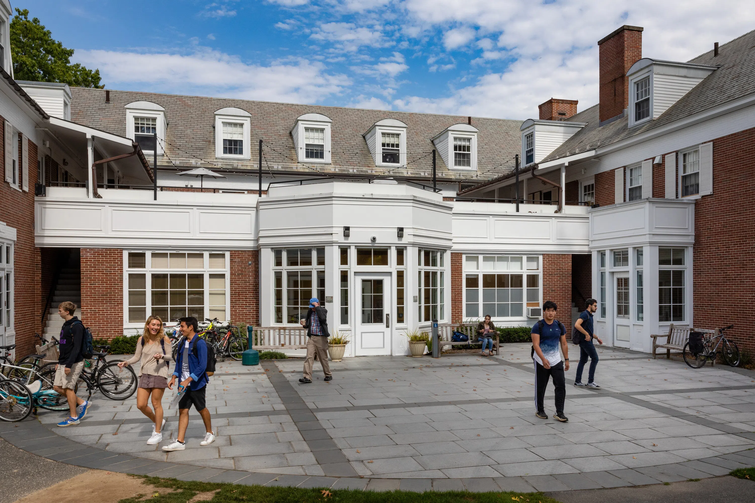 Exterior shot of backdoor of Valentine Dining Hall with students walking by