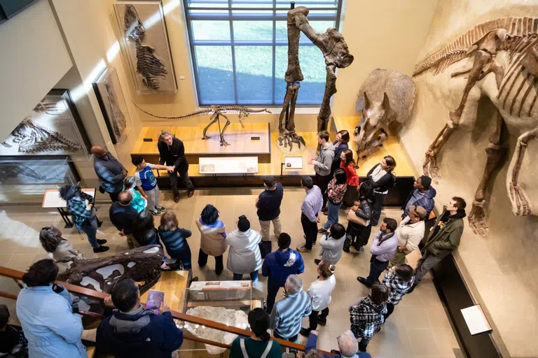 Group of people tour the Beneski Museum.