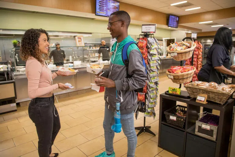 Students grabbing food at The Chat