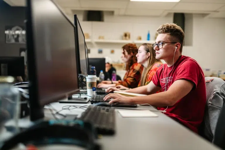 Student working in the Graphic Design studio