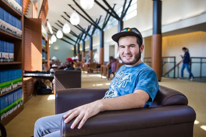 Student sitting on the second floor of The Landman Library