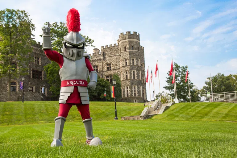 Knight mascot on Haber Green with Grey Towers Castle in the background