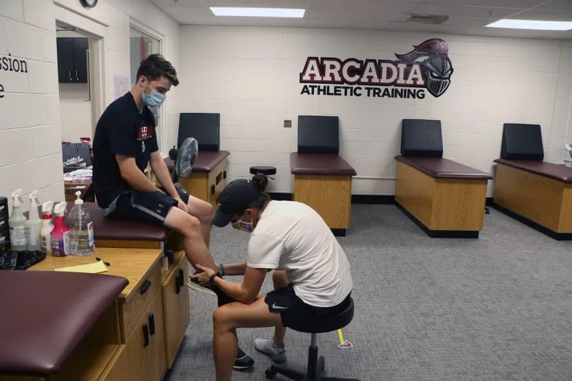 Student is treated by an athletic trainer