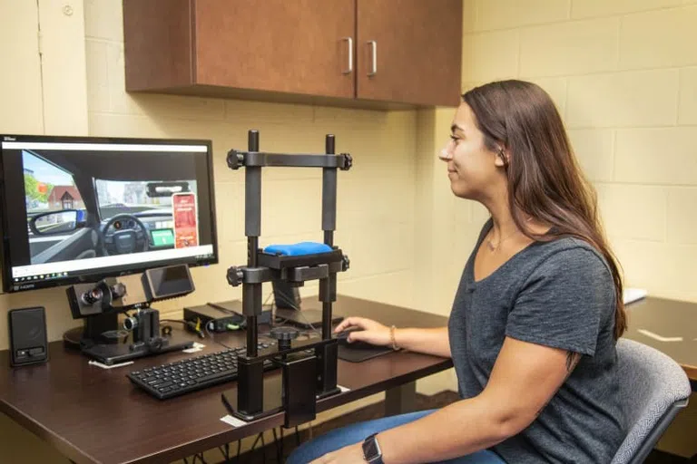 Student working in a Psychology Attention, Memory & Cognition lab