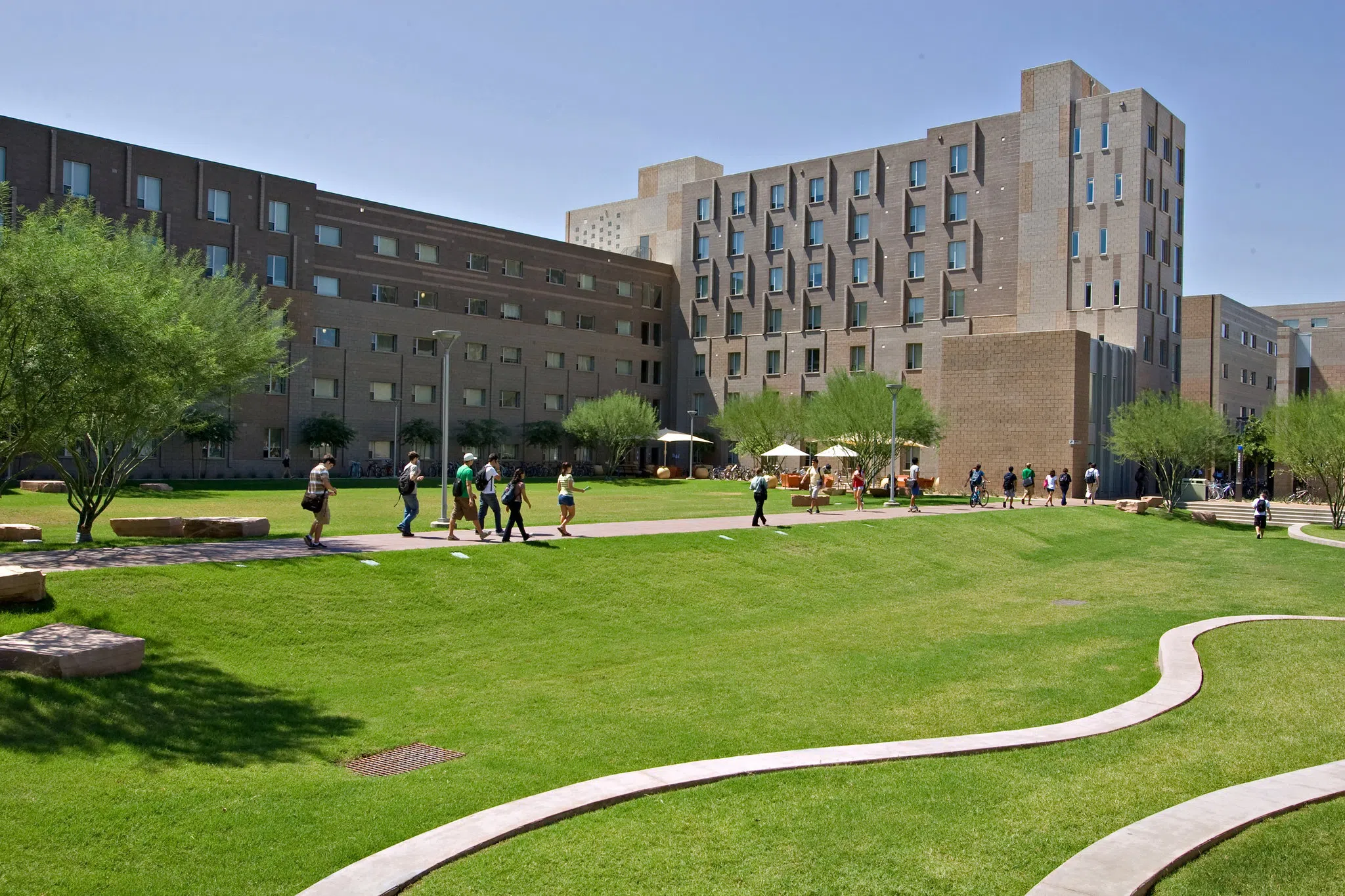 Students walk through large courtyard within the Barrett Academic Complex between classes.