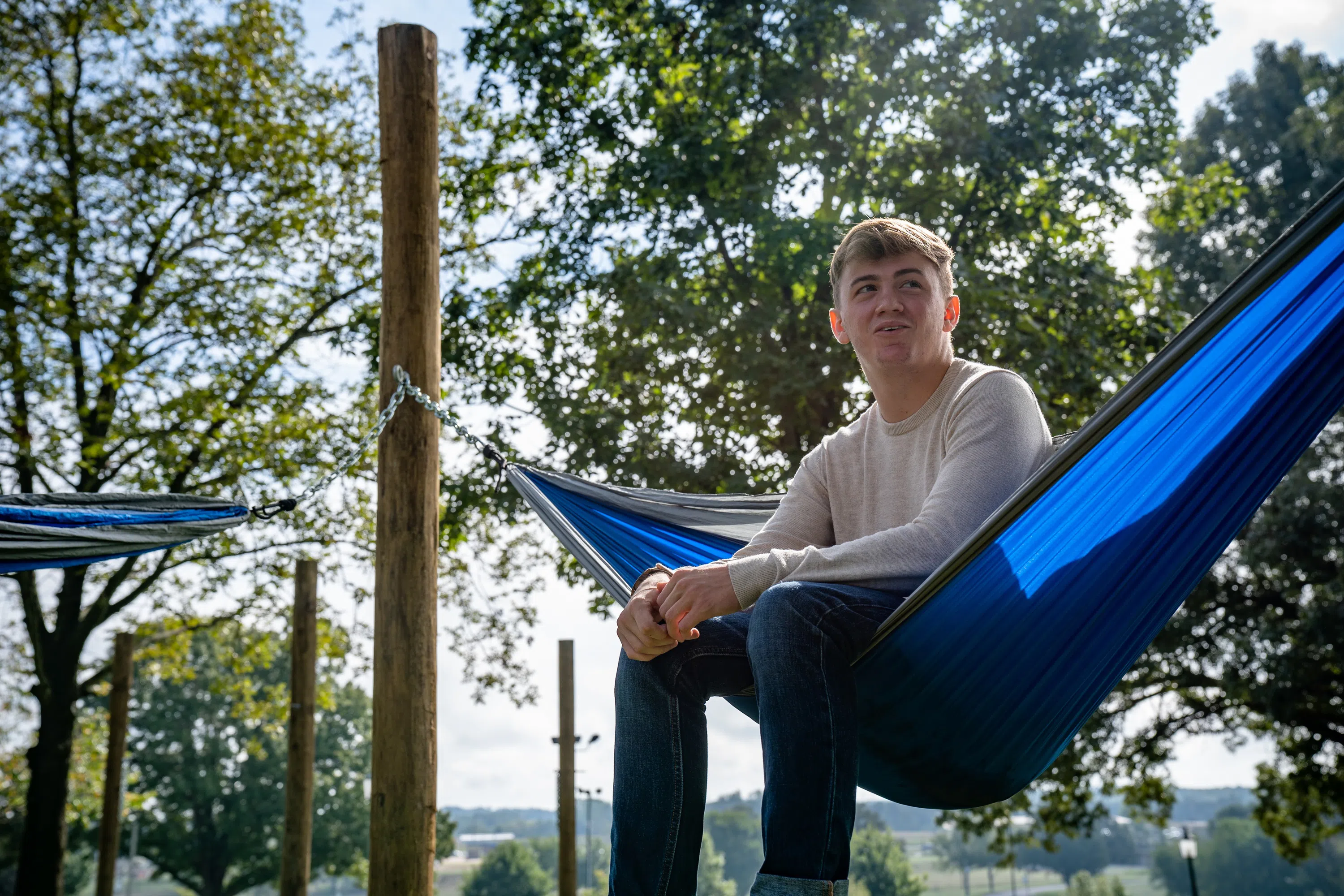 Image of student sitting in hammock outside