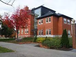 Exterior of Roger Williams Hall. The building is red brick with glass window cutouts. 