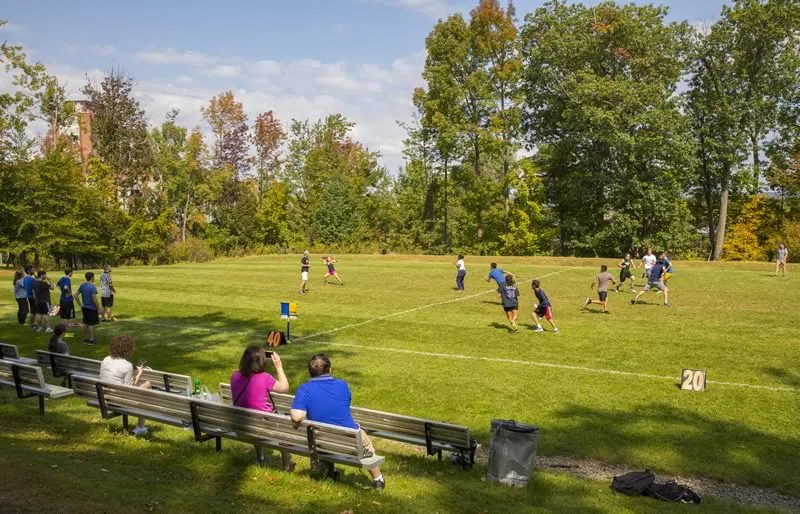 Students playing on CIW recreational field