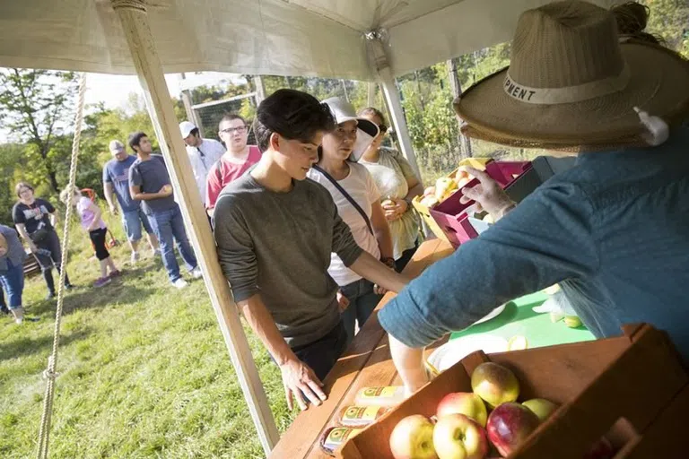 Fruits being handed out at the BU Acres Farm