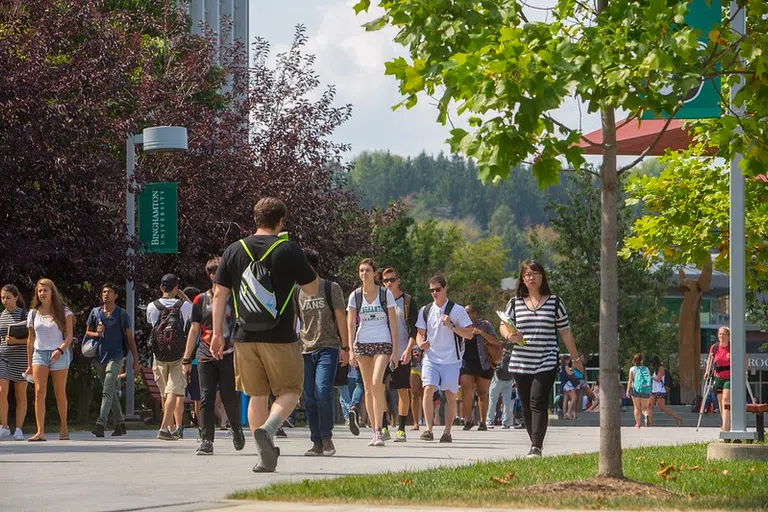 Students walk along the campus spine