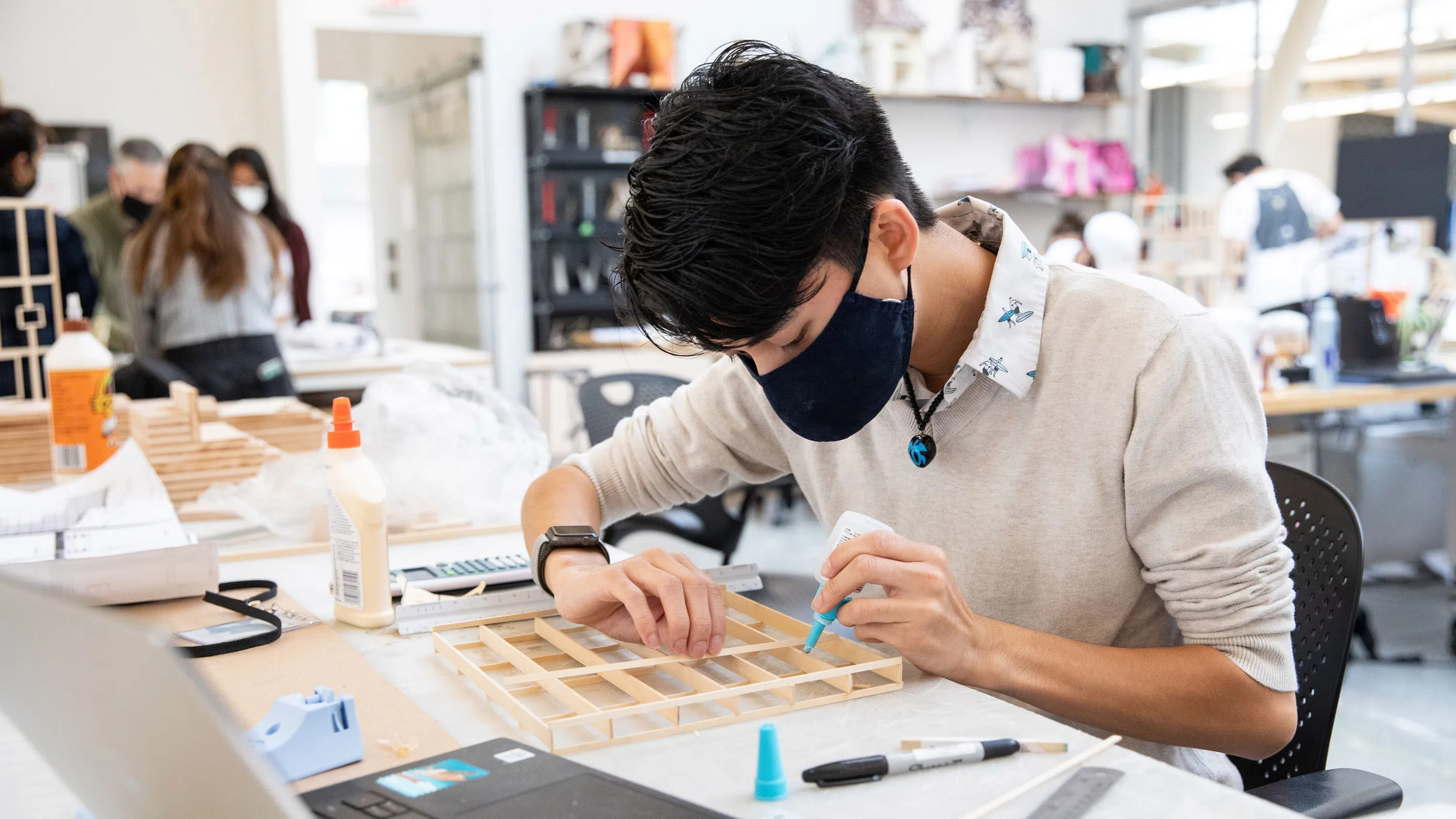 A close-up of a student working on a model in the Architecture studio.