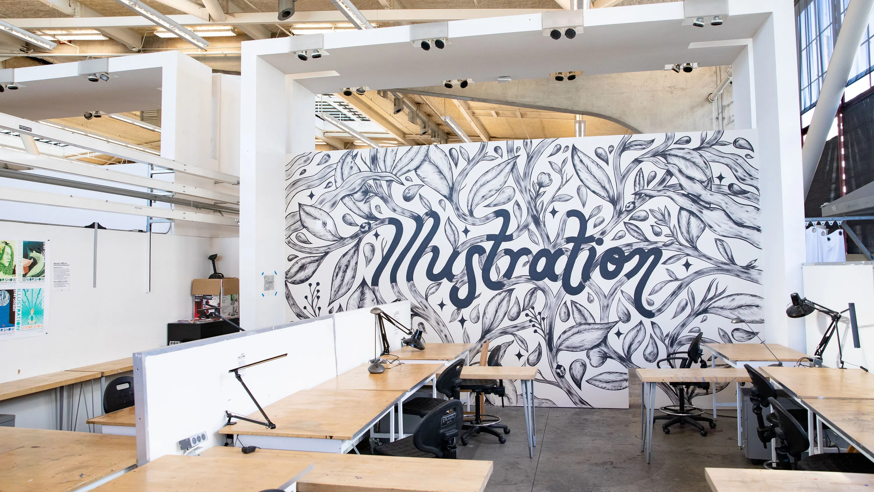 A black-and-white mural of branches and leaves reveal the word “Illustration” in organic cursive.
