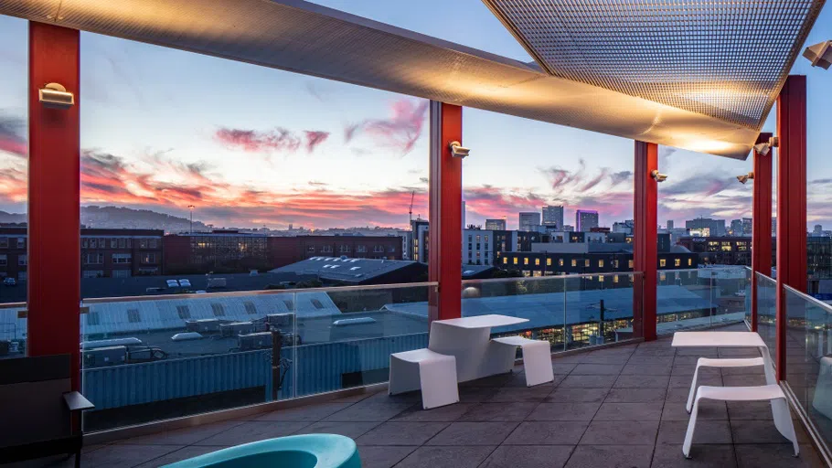 The terrace with a dramatic purple and orange sunset.