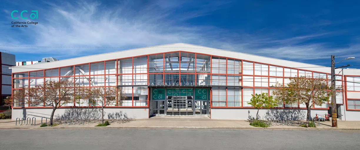 An exterior view of the Montgomery Building; teal vinyl reads California College of the Arts.