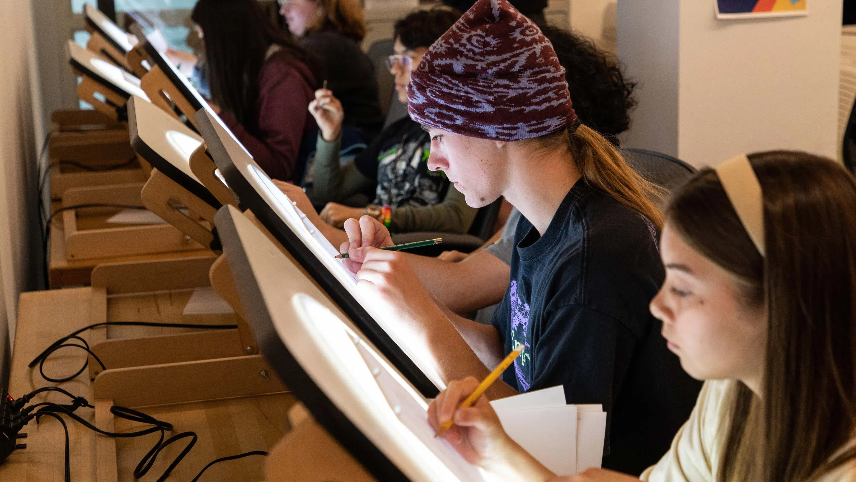 Students draw on lighttables