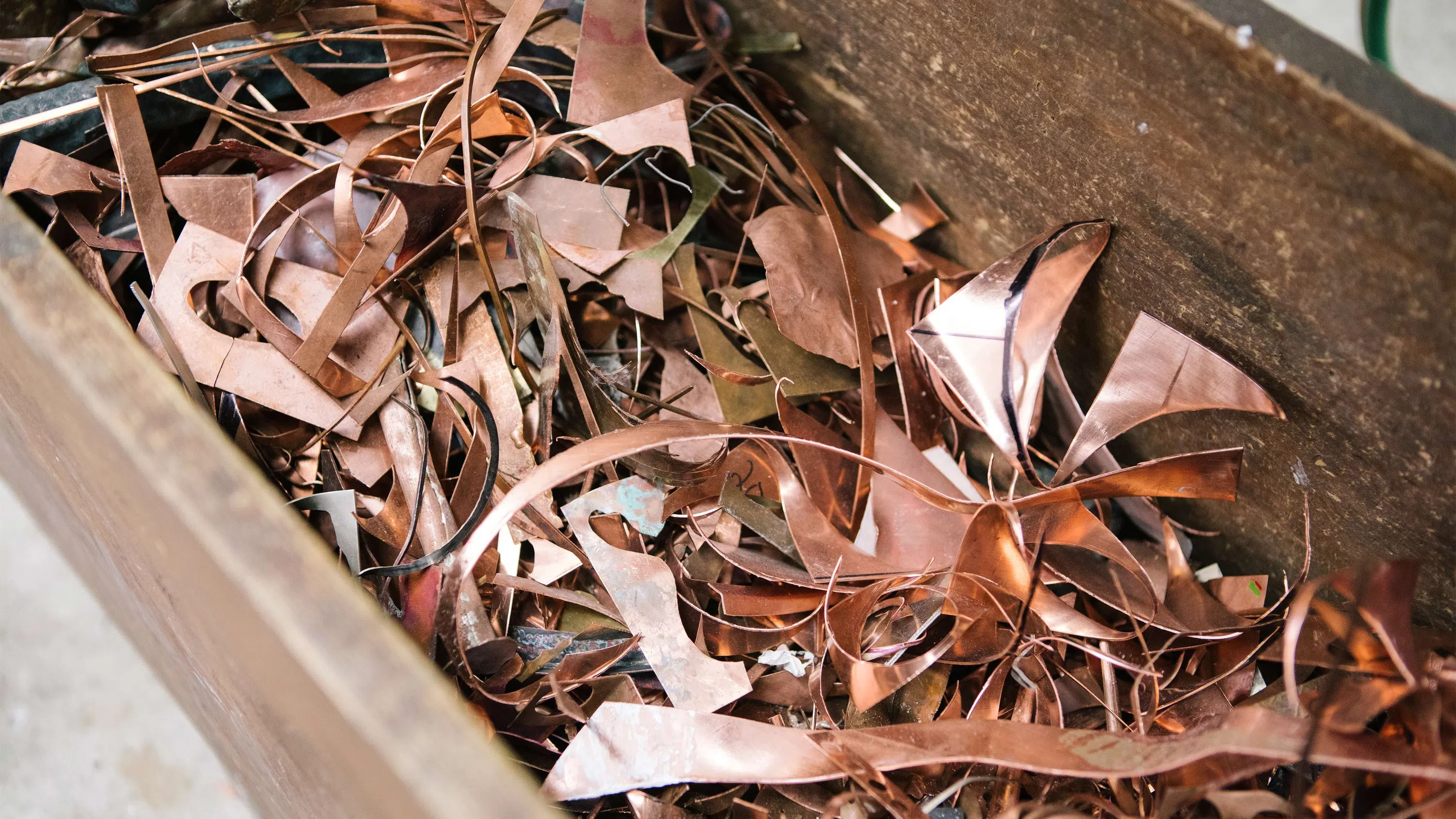 A close-up of irregular scraps of copper.