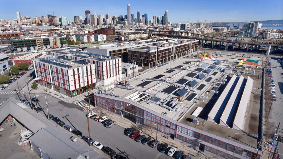 Drone photography overlooking CCA’s Main Building and residence hall, with the San Francisco skyline in the background. 