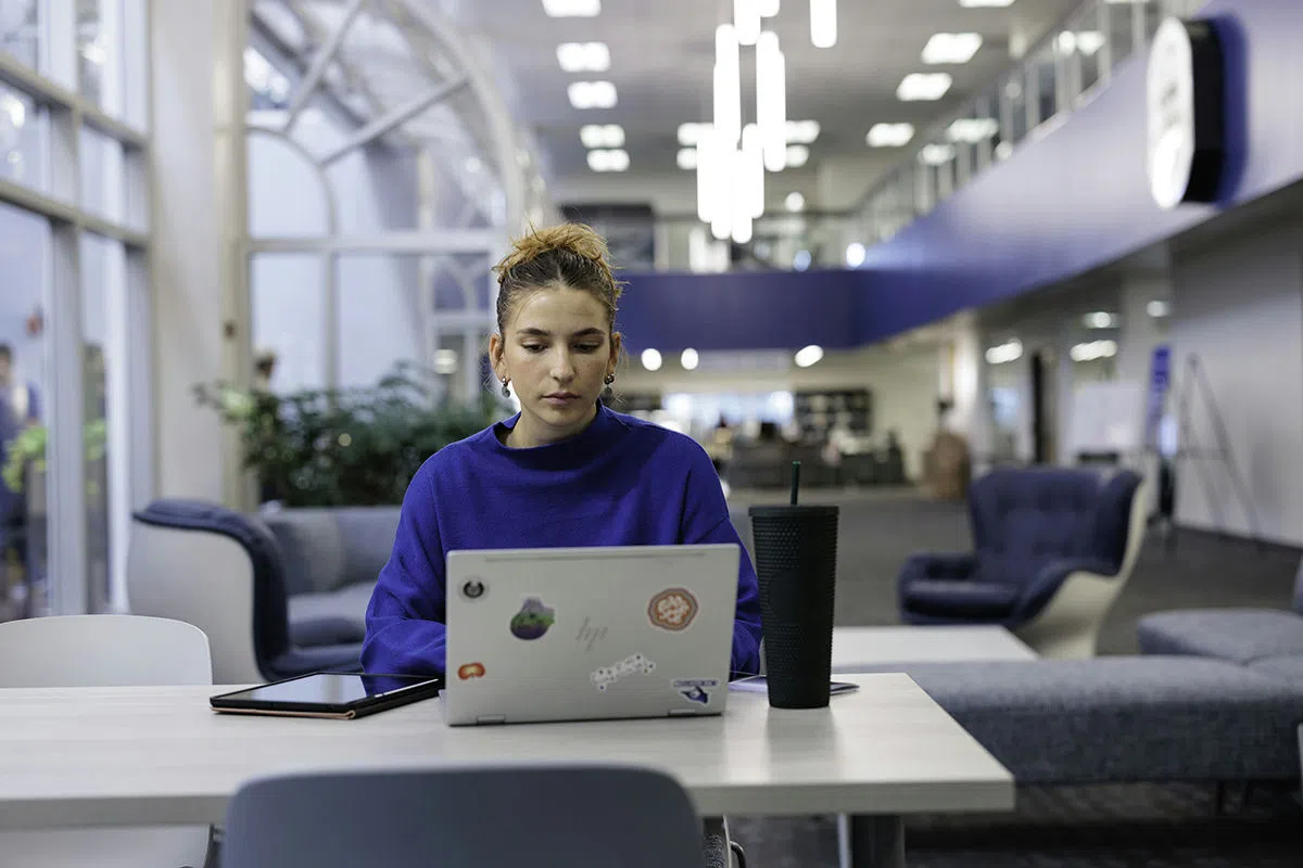 Student studies her notes in the library