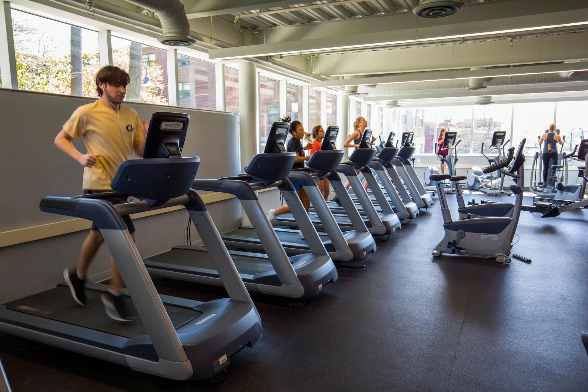 students exercising on treadmills