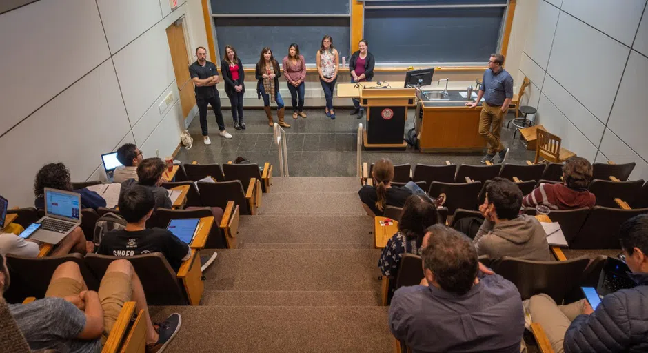 students giving presentation in lecture hall