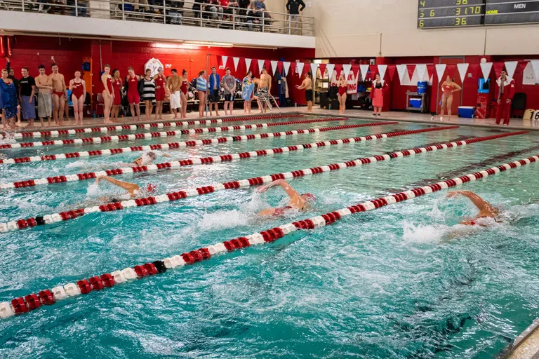 students competing in swim meet