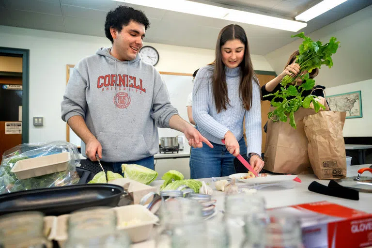 Members of Anabel’s Grocery conduct a pickling demonstration in Anabel Taylor Hall.