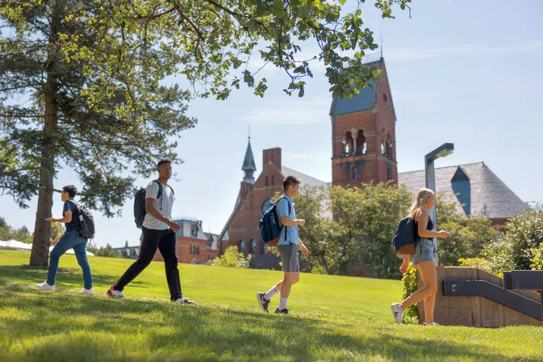 Students pass by Barnes Hall between classes.