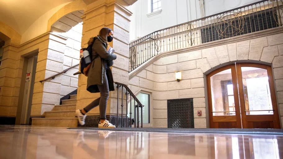 Students leave Warren Hall as afternoon classes let out.