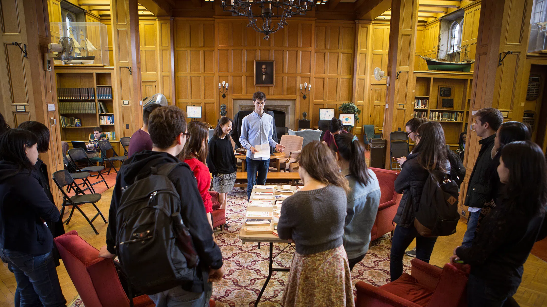 Members of Book Wagon, a student-run program to promote reading literature for leisure, gather in Willard Straight Hall.