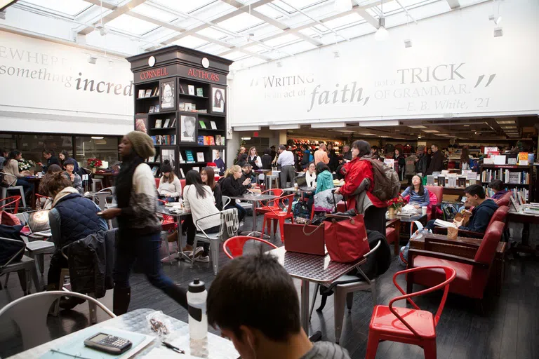 Café Jennie at the Cornell Store buzzes with activity as students sit at tables and on couches, sipping coffee, eating snacks and working on their laptops.