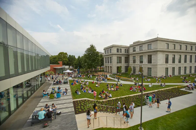 Ovehead view of Frieberger Field with a large group of students hanging out