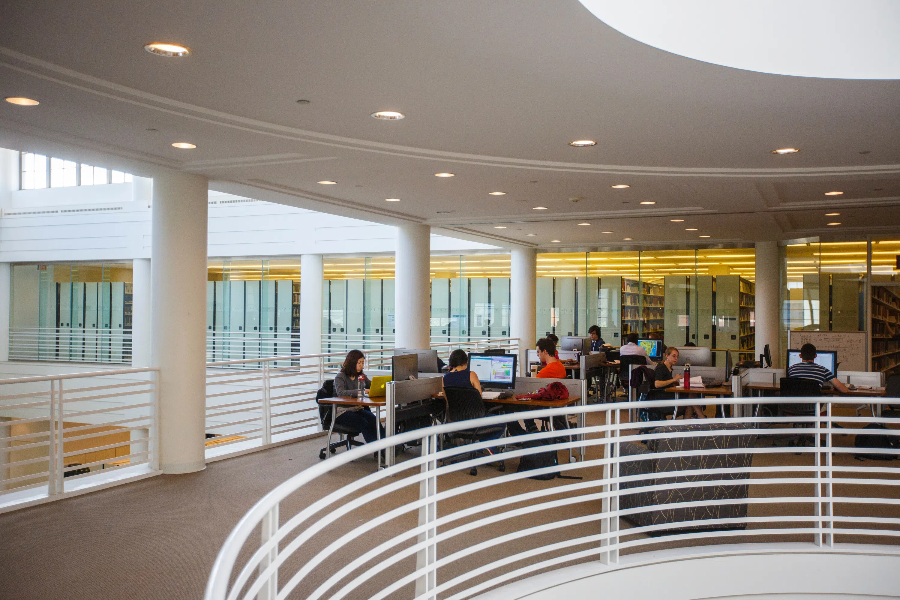 Students working at tables in the library