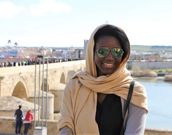 Student smiles at the camera during study abroad trip