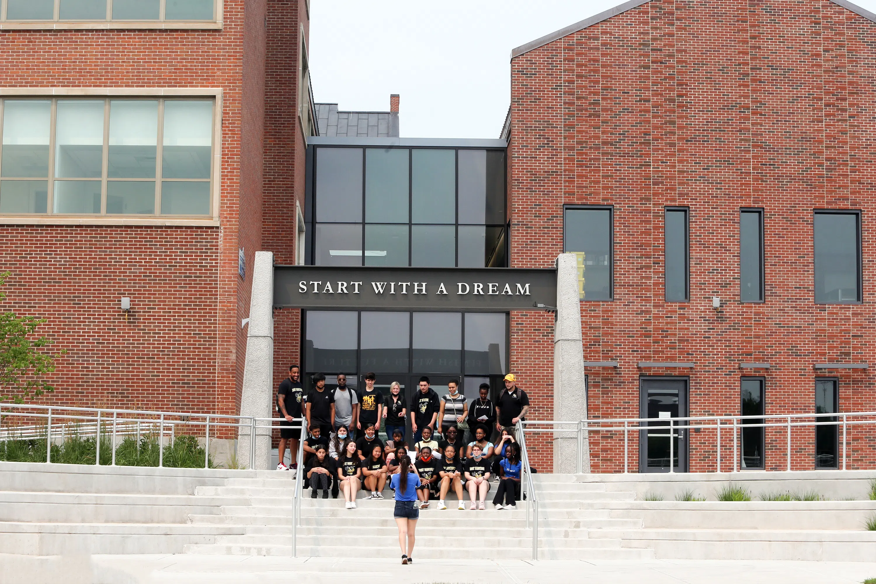 Students pose on the newly built steps into Barnard Hall