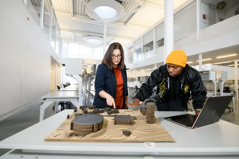 A student and his professor work together in the Lee III studio.