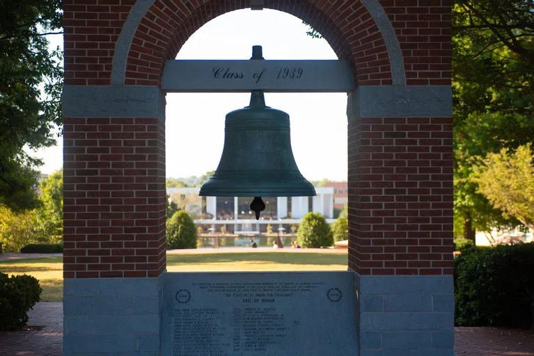 The Carillon Bell, with the North Green and the Library in view behind it.