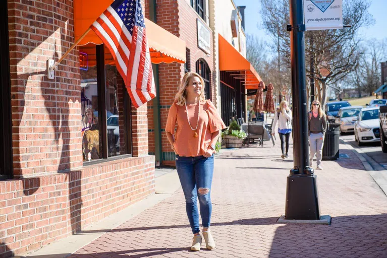 Clemson student Bailey Hack walks down College Avenue.