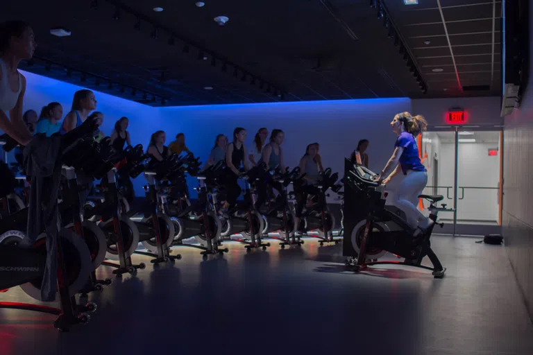 Students participate in a cycling class in Fike Recreation Center.