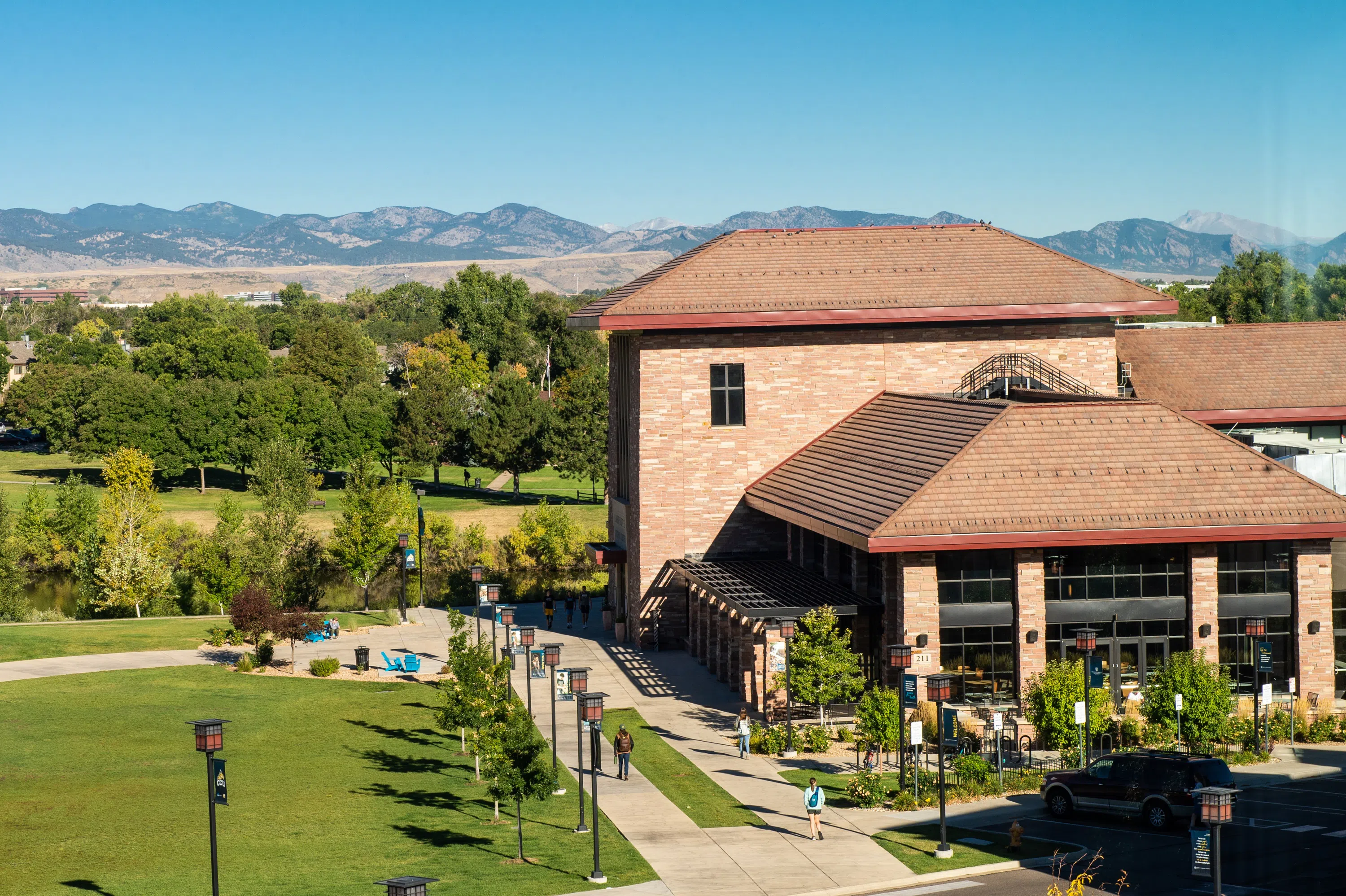 side view of Anschutz Student Center with mountains in the background