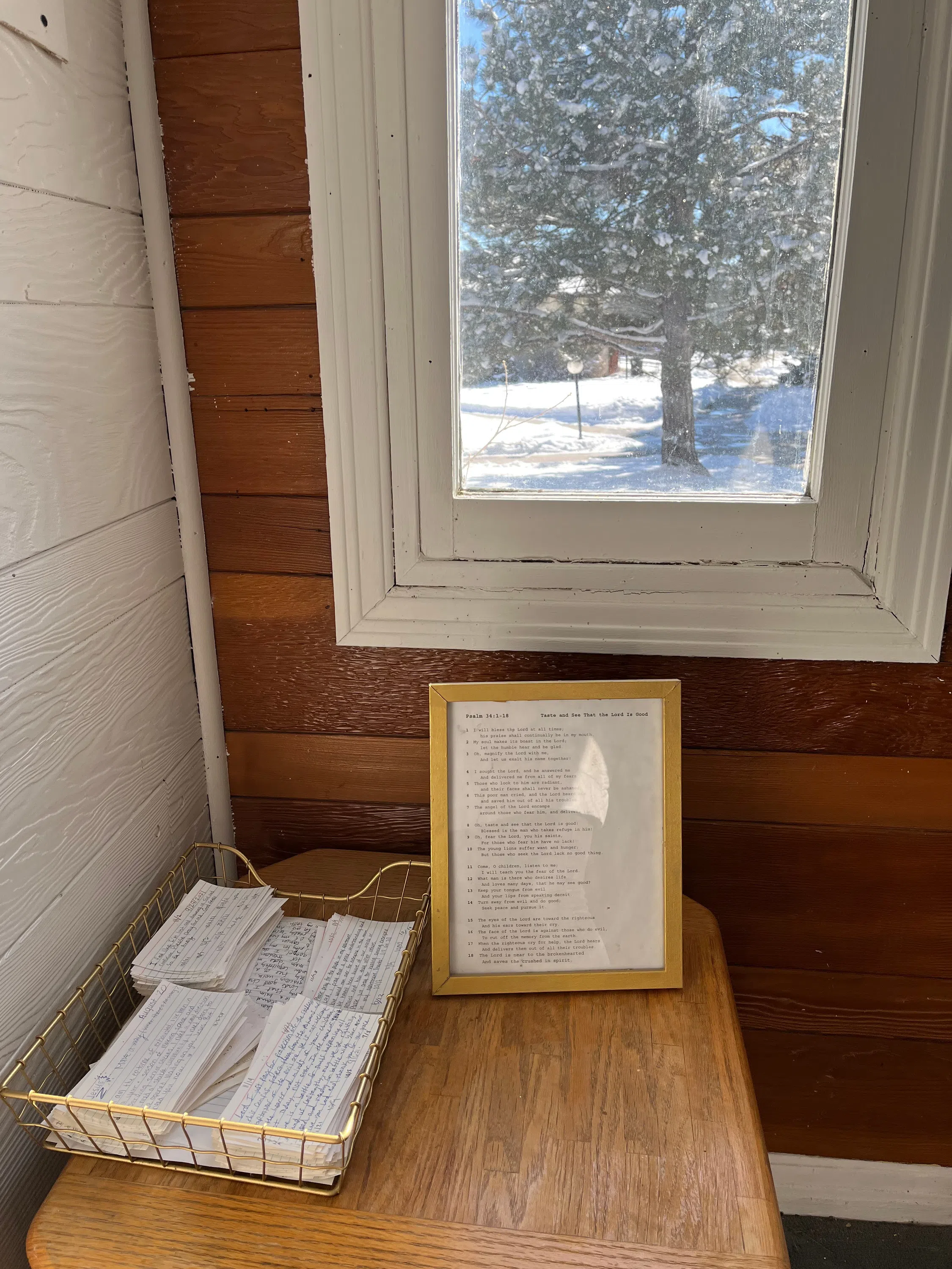Notecards in a wire basket with a verse printed in a frame