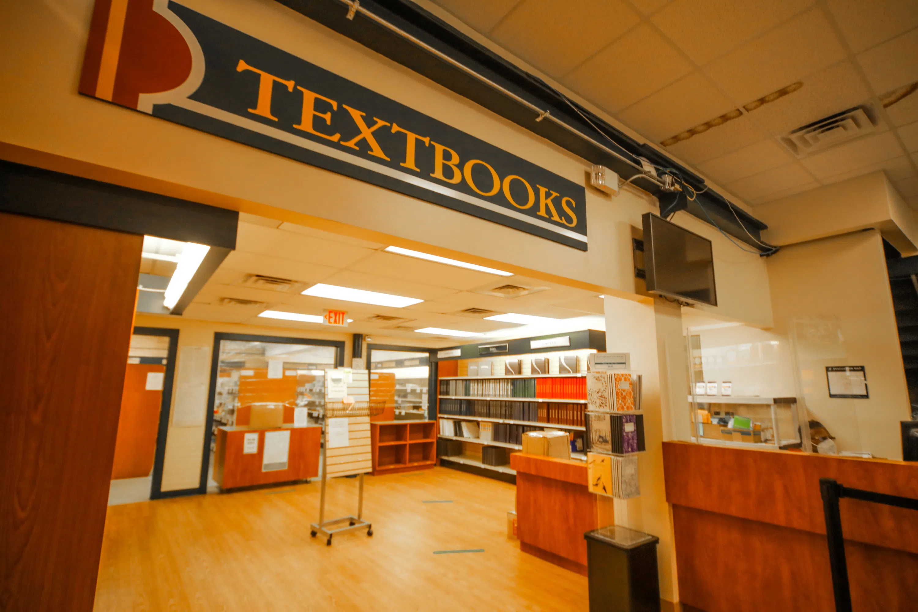 open area with books and large sign that says textbooks