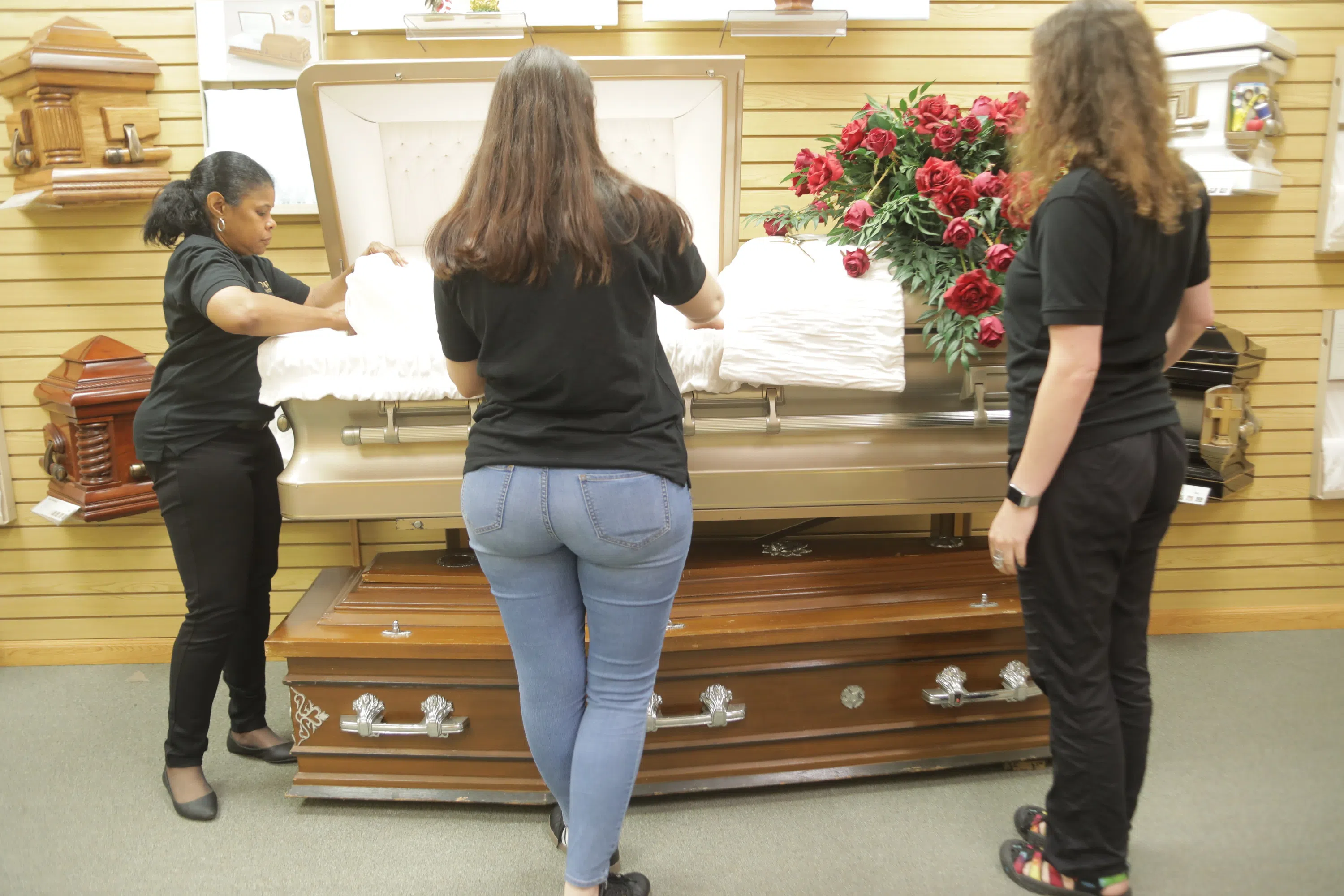students standing around a casket