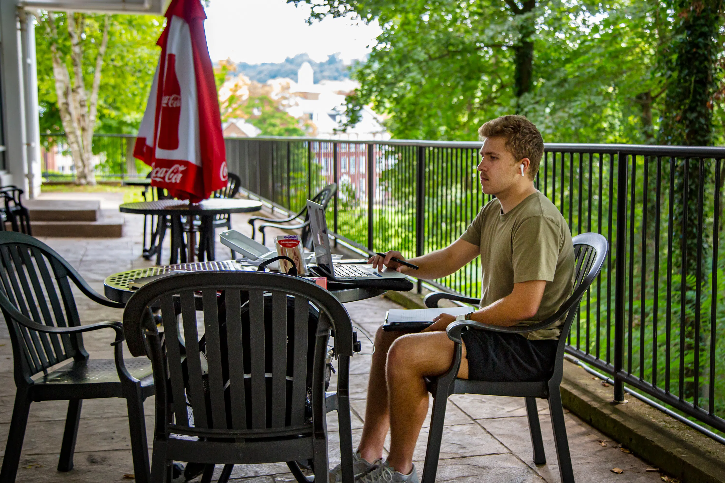 Student studying and enjoying the patio at Madden Student Center