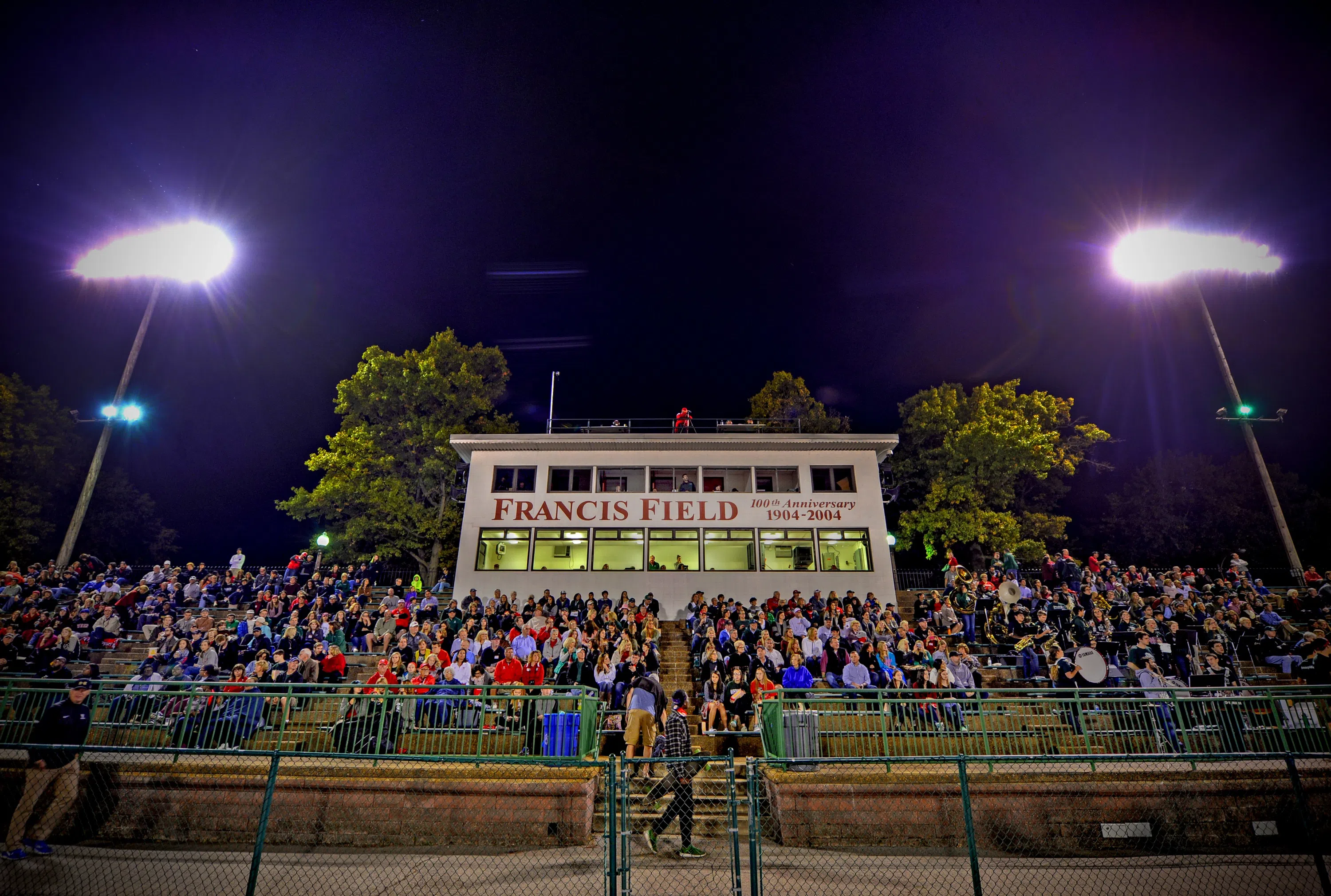 Fans in the stands at Francis Field during a night time game